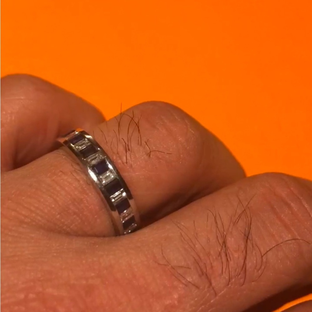 Eternity Band: 18K White Gold; 18 baguette cut Diamonds & 18 Blue Sapphires